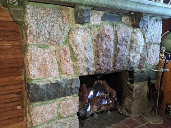 A fireplace in a stone room

Description automatically generated with low confidence
