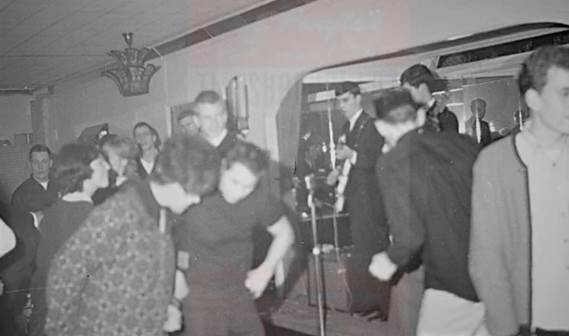A group of people dancing in a room

Description automatically generated with medium confidence